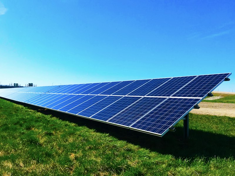 Technician planning a solar installation on a tablet